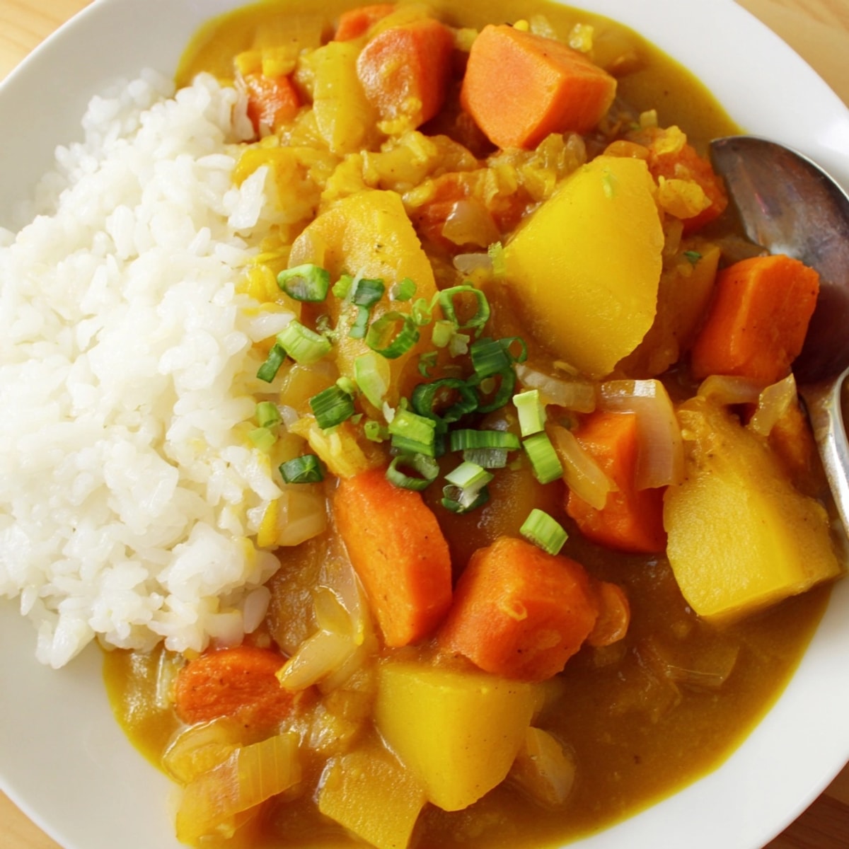 Savory Japanese Curry Pumpkin Twist simmers warmly, golden cubes nestled in rich sauce.