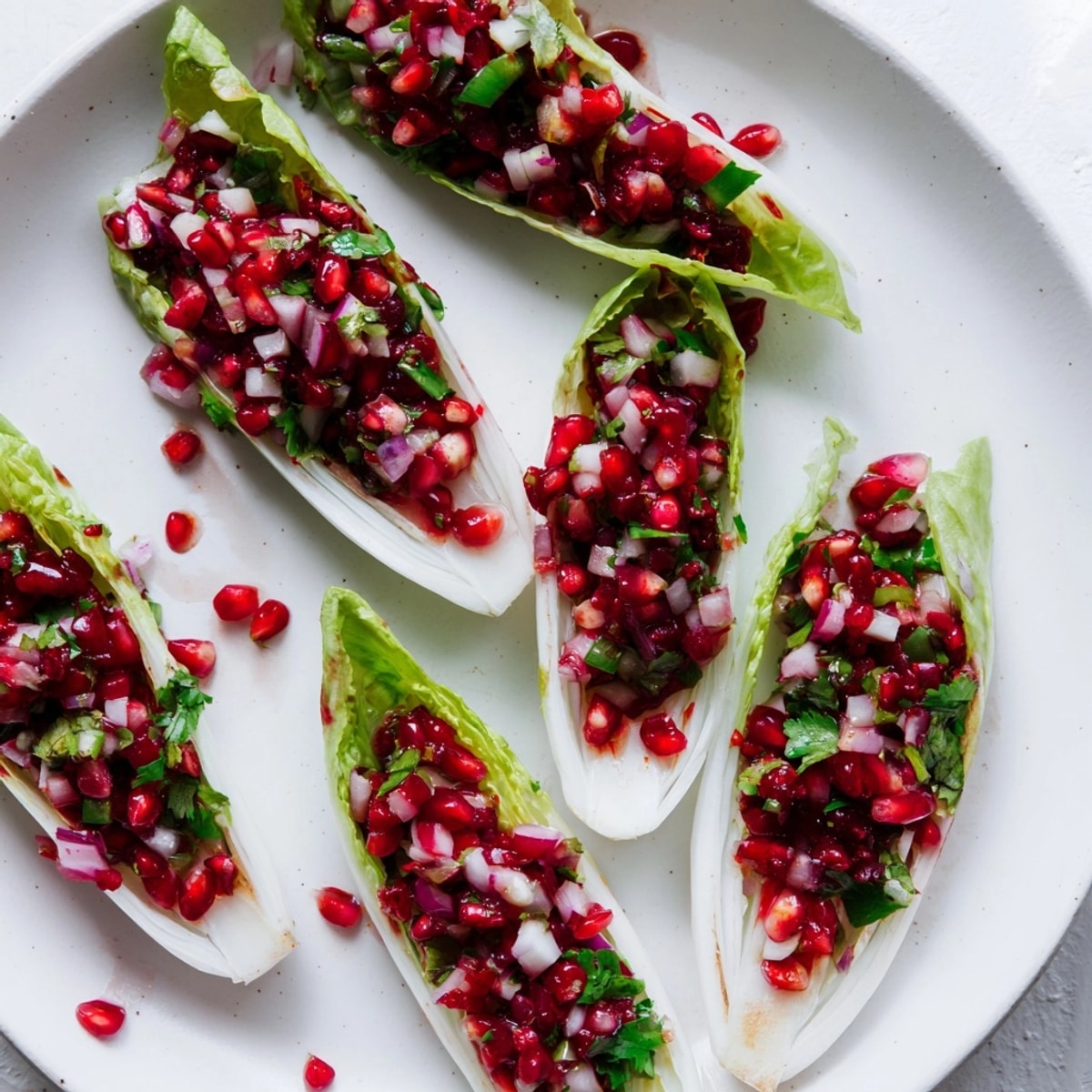 Vibrant Cranberry Jalapeño Salsa Boats: Tangy and spicy appetizer displayed on a platter.