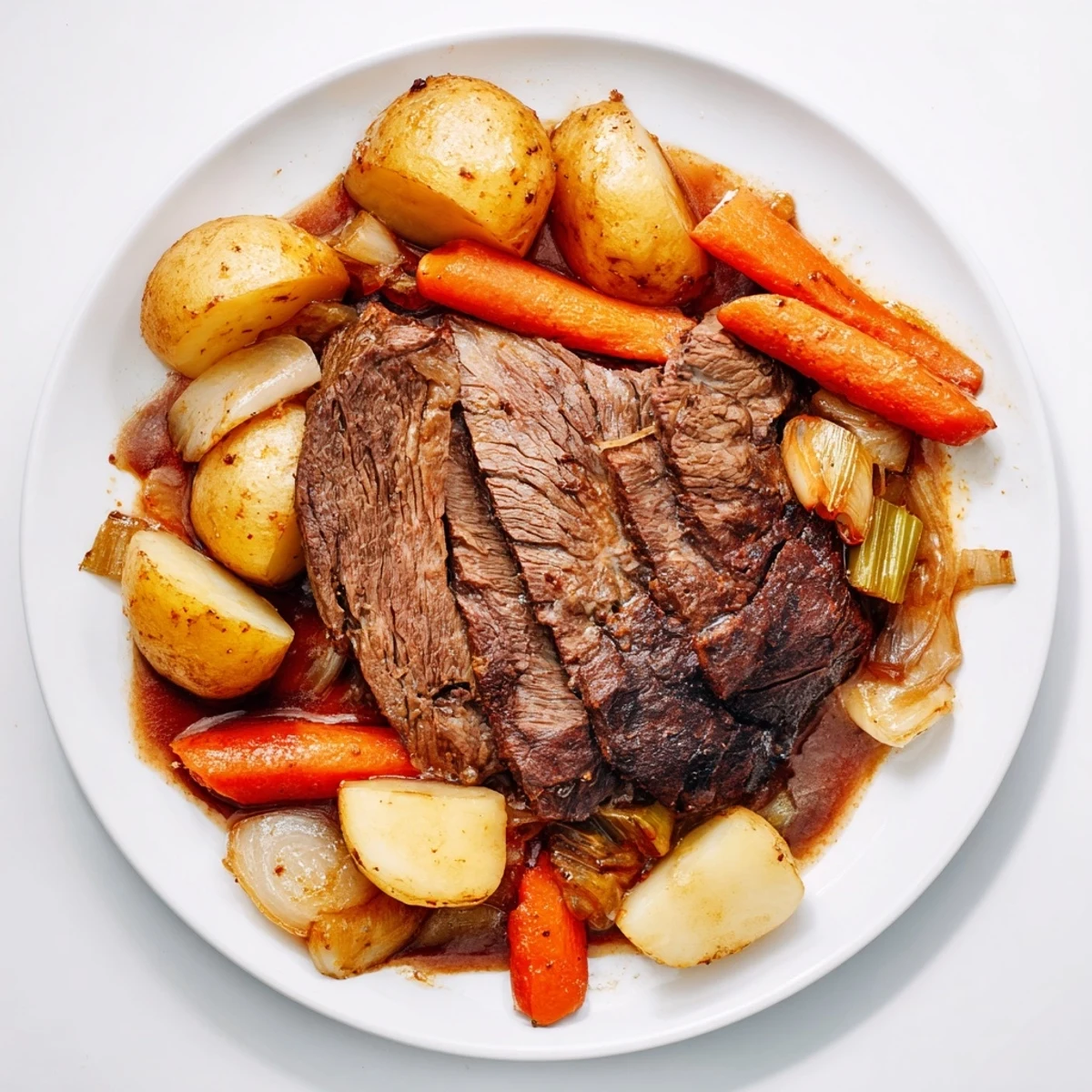 A hearty Sunday Pot Roast served with vibrant vegetables and savory beef broth.  