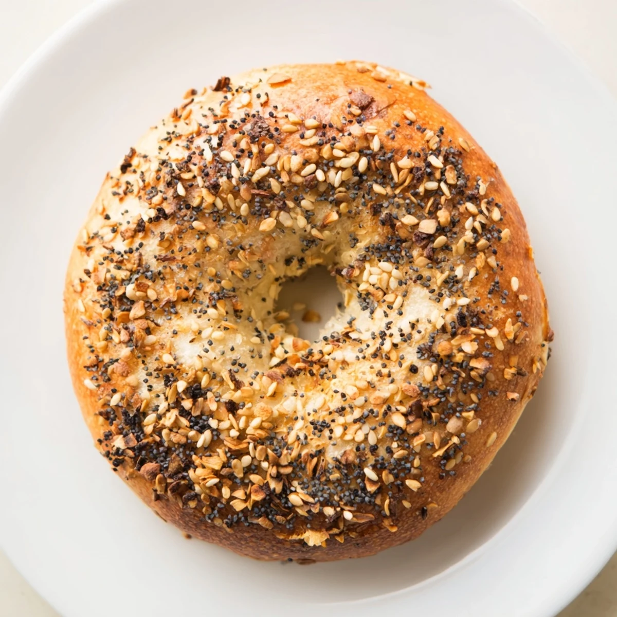 Warm, golden-brown Homemade Budget Bagels, fresh from the oven, offering a delightful chewy texture.