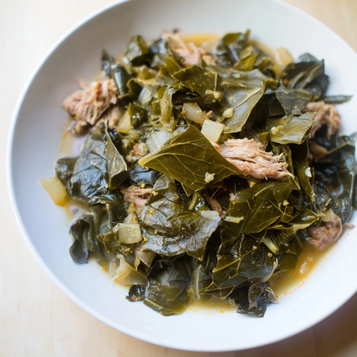 Steaming Southern style collard greens with tender smoked turkey, a vibrant and flavorful side dish.