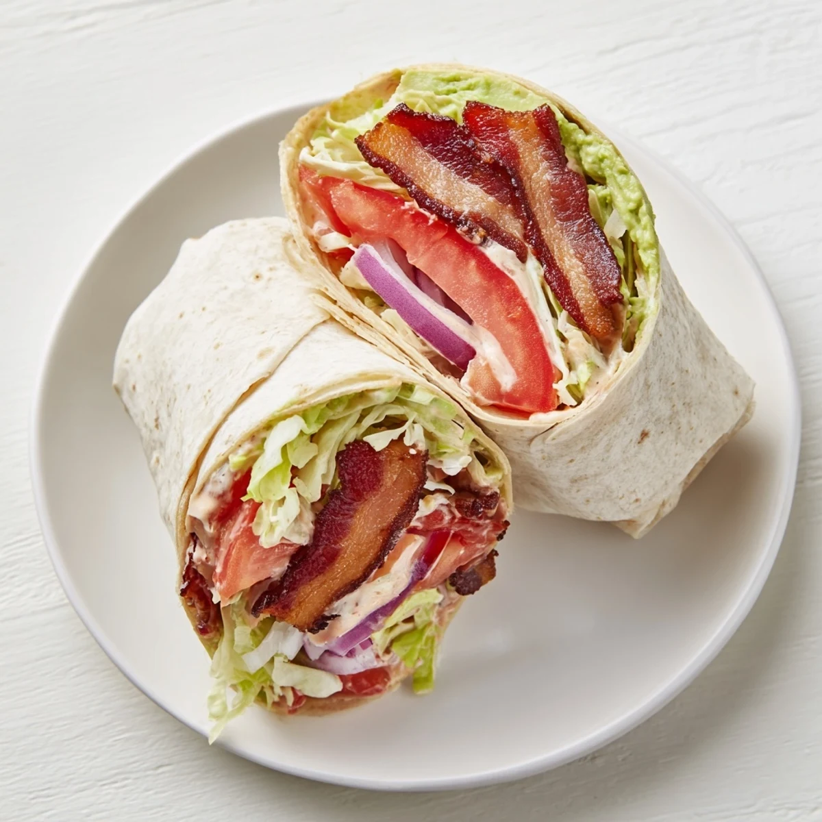 Image of a Zesty BLT Wrap, showing a filling of crispy bacon and fresh veggies.