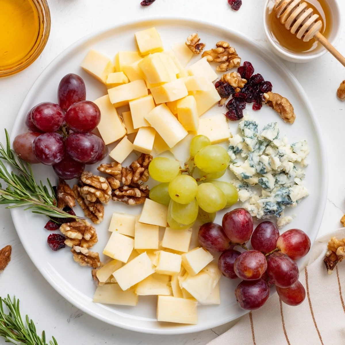 Cranberry Grape Man Cheese Board boasts colorful grapes, nuts, cheeses, and crackers for a perfect appetizer.