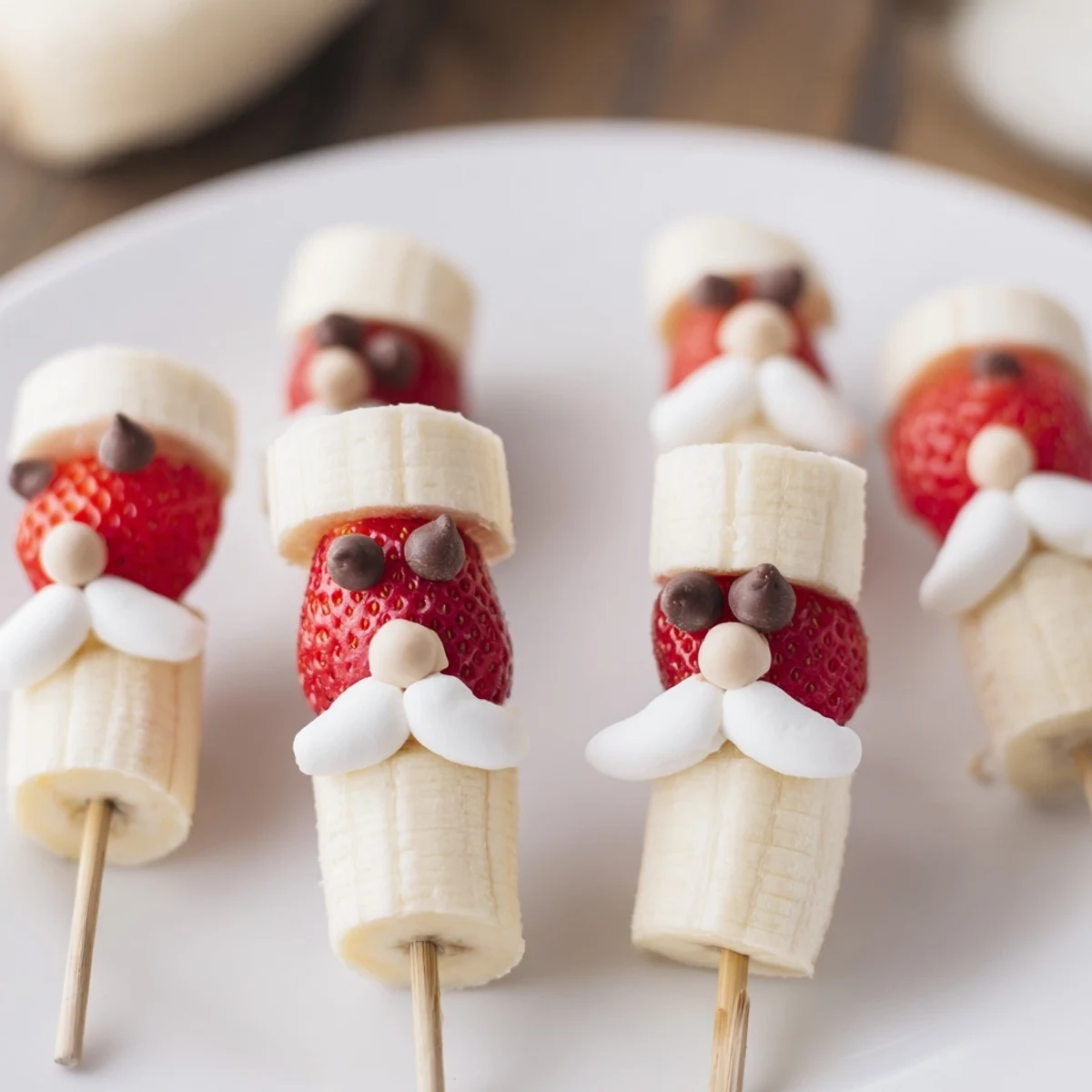 Vibrant Banana Strawberry Santa Skewers offer a festive look, showcasing fresh bananas, strawberries, and sweet details.