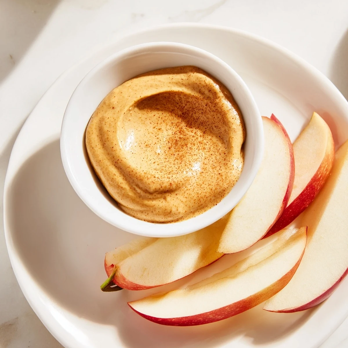 Get a healthy energy boost with crunchy apple slices and a rich peanut butter dip ready to eat.