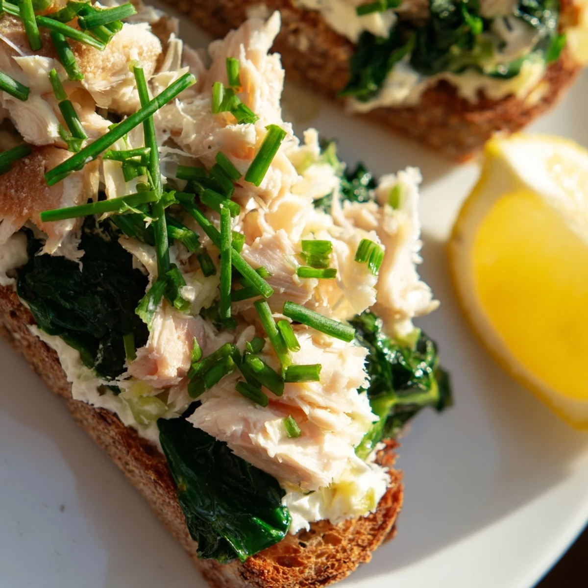 Golden toasted rye bread topped with flaky smoked haddock and vibrant wilted spinach, finished with creamy crème fraîche.