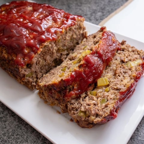 Golden and savory Effortless Stove Top Stuffing Meatloaf Hack, ready to be sliced, a true comfort food.