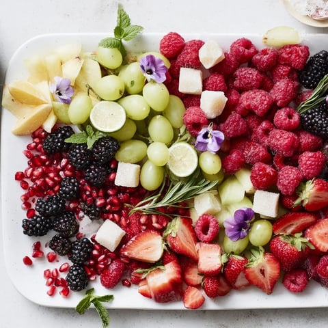 Bubbly Bar New Years Eve garnish tray: vibrant arrangement of fresh fruits and herbs for festive cocktails.