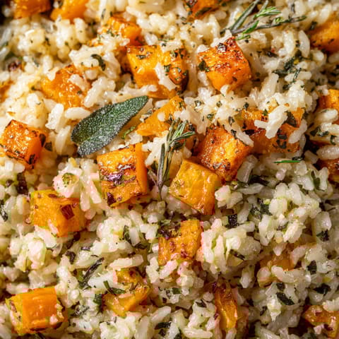 A close up of rice with vegetables.