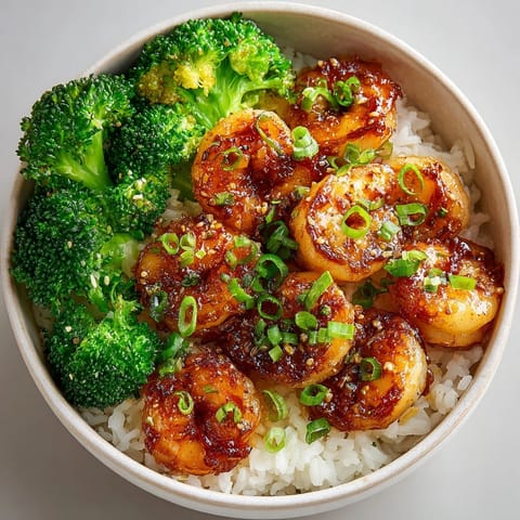 Colorful 20-Minute Honey Garlic Shrimp Bowls featuring glazed shrimp, vibrant vegetables, and sesame seeds