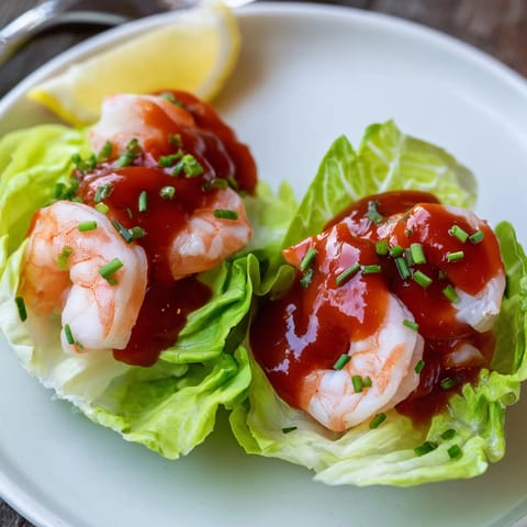 Easy shrimp cocktail cups recipe: Plump, pink shrimp bathed in tangy homemade cocktail sauce.