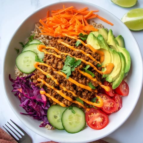 Wholesome plant-based meat bowl featuring tender avocado and crunchy red cabbage.  