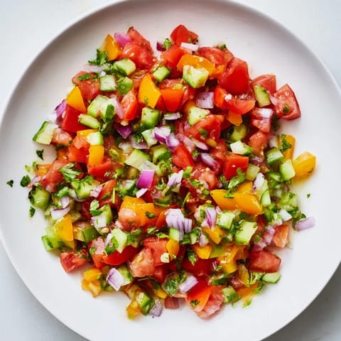 Close-up of bright red and green Pickle De Gallo salsa, a refreshing topping with citrus notes.