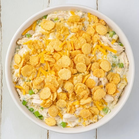 A creamy, cheesy Neiman Marcus-Style Chicken Casserole showcases tender chicken and a crunchy, delicious crust.