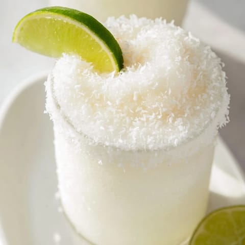 Frosted, creamy White Christmas Margarita Slush, perfect for a shimmering holiday cocktail.