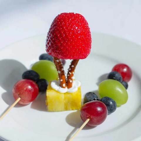 Christmas Light Fruit Skewers bursting with colorful fruit, ready for a fun, healthy snack at your holiday party.