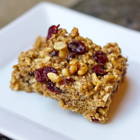 Delicious, homemade Maple Cinnamon Oatmeal Bars; a wholesome breakfast treat ready to enjoy.