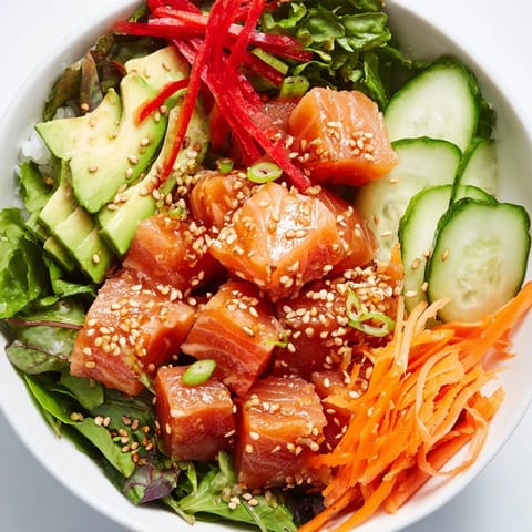A close-up view of a vibrant Poke Bowl Salad, showcasing marinated tuna and crunchy toppings, ready to enjoy.