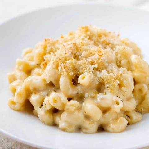 Creamy stovetop mac and cheese with melted cheese, ready to be served hot and delicious.
