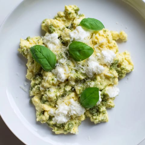 Green pesto swirls through soft scrambled Pesto Cottage Cheese Eggs, a quick and delicious breakfast idea.