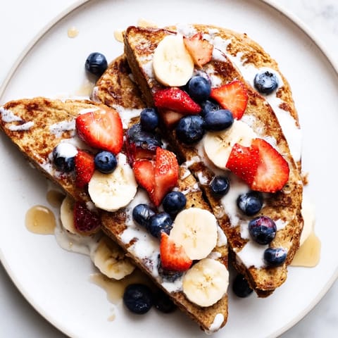 Warm, custardy protein French toast, cooked to perfection, showcasing a satisfying breakfast plate.