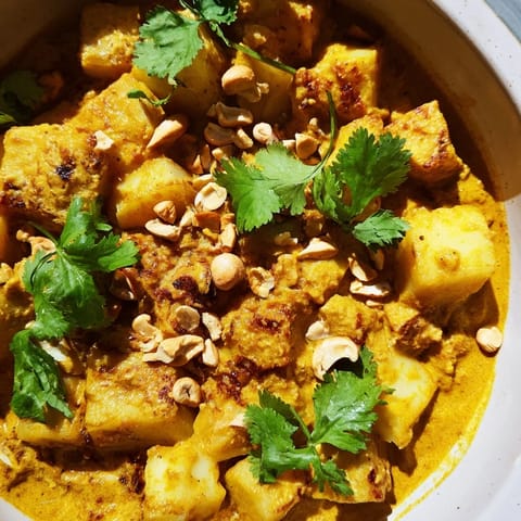 A hearty vegetarian Curried Celeriac main dish served alongside fluffy steamed white rice.