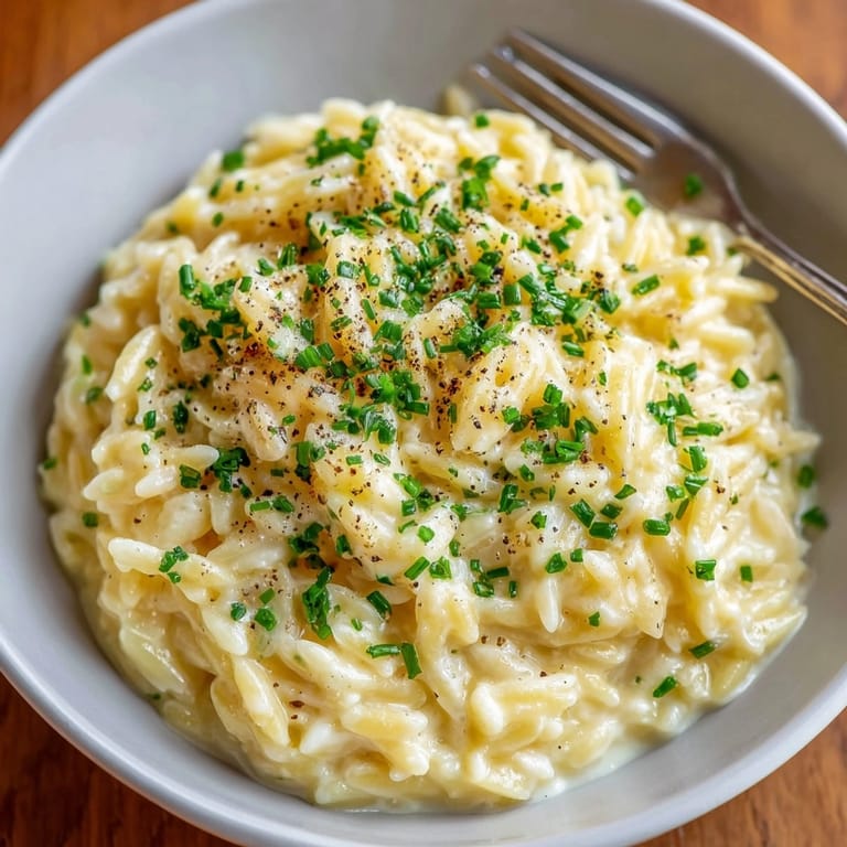 Warm, aromatic Parmesan Truffle Orzo, ready to be served with a crisp Chardonnay.