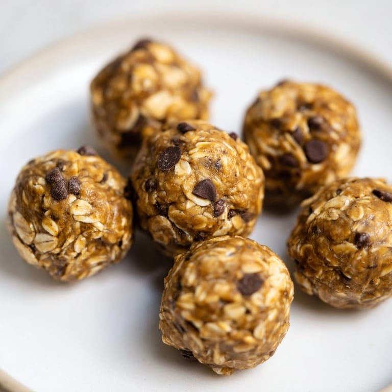 Homemade Peanut Butter Espresso Energy Balls ready to serve, glistening with nutty and sweet richness.