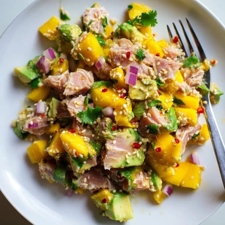Fresh tuna, creamy avocado, and sweet mango combine in Spicy Mango & Avocado Tuna Salad.