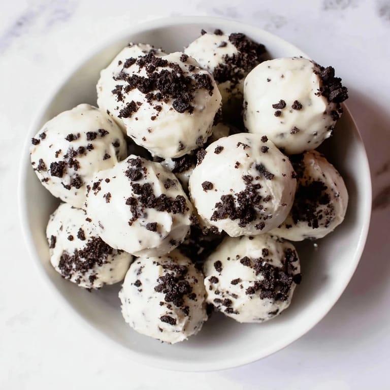 Imagine: a close-up shot of several perfectly formed Cream Cheese Oreo Protein Balls, ready to enjoy.